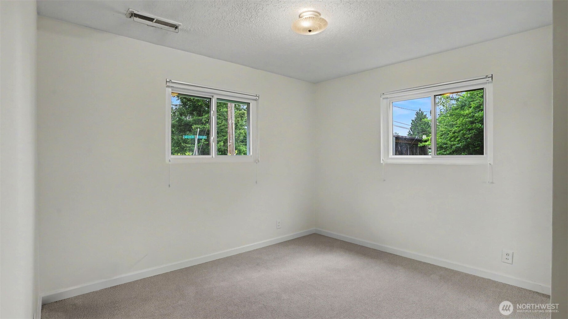 12515 Southeast 171st Street Renton, WA 98058 - Photo 18 of 24 an empty room with a window