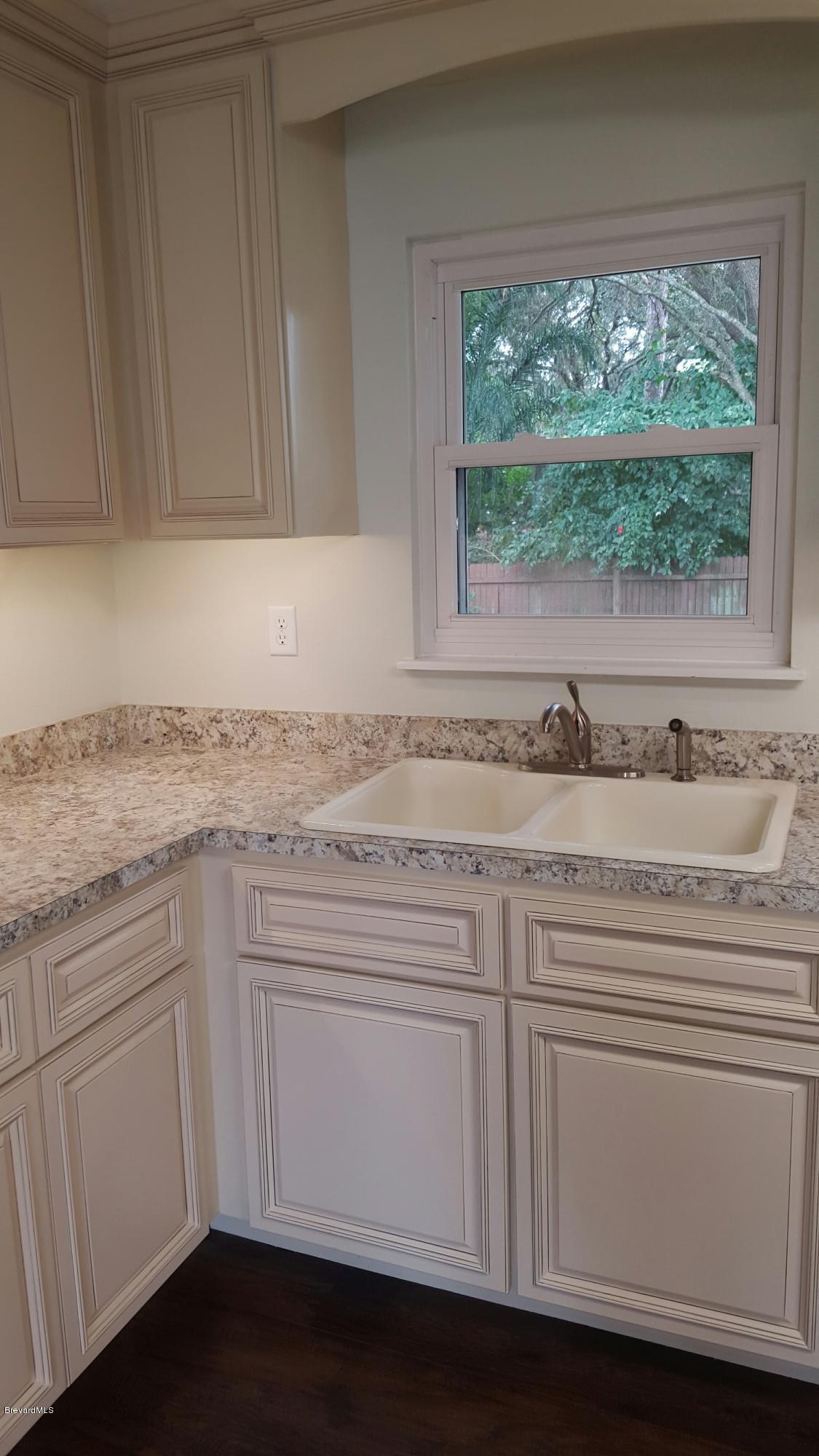 7401 Ester Road Cocoa, FL 32927 - Photo 12 of 41 Kitchen window overlooks backyard