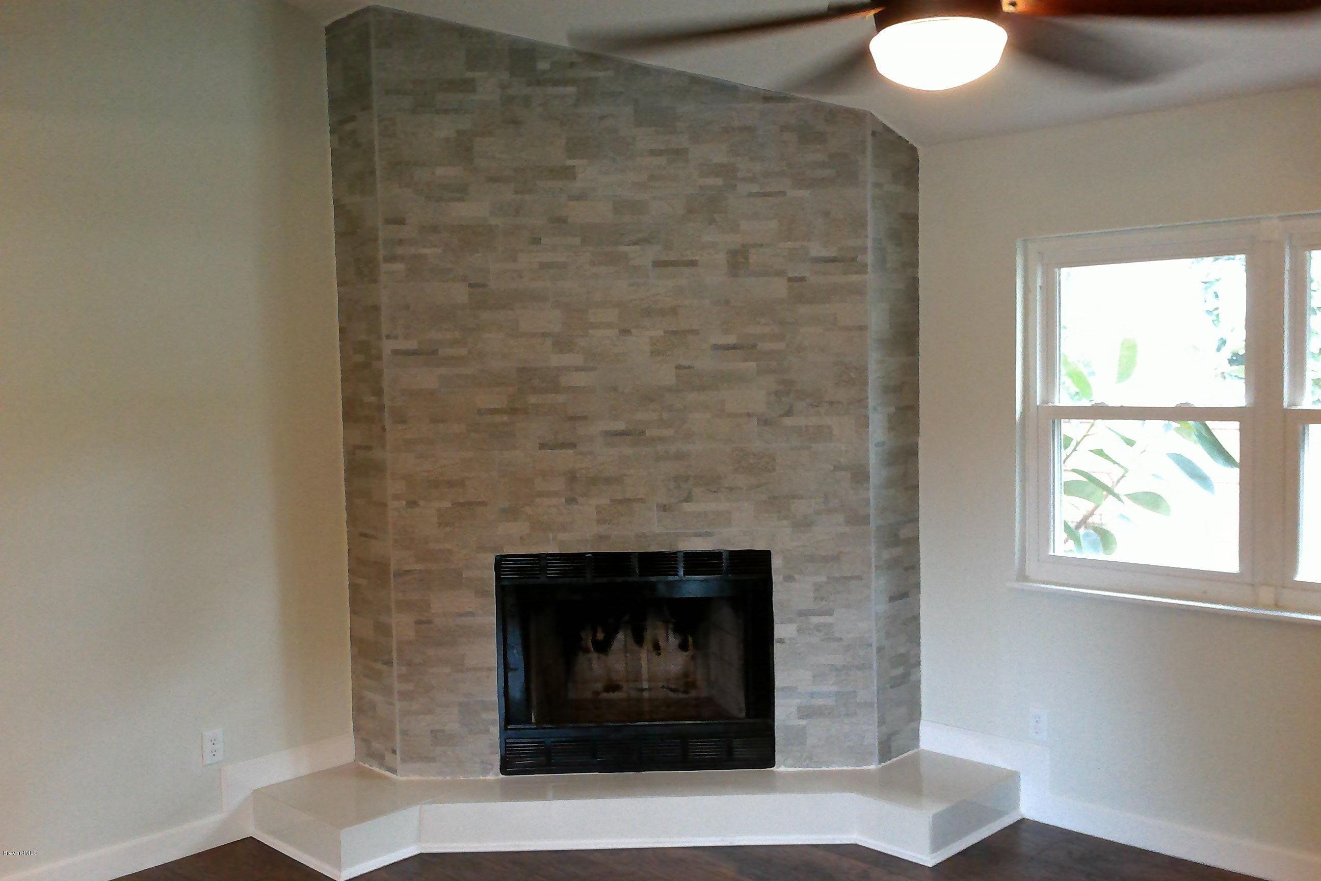 7401 Ester Road Cocoa, FL 32927 - Photo 16 of 41 Fireplace in living area