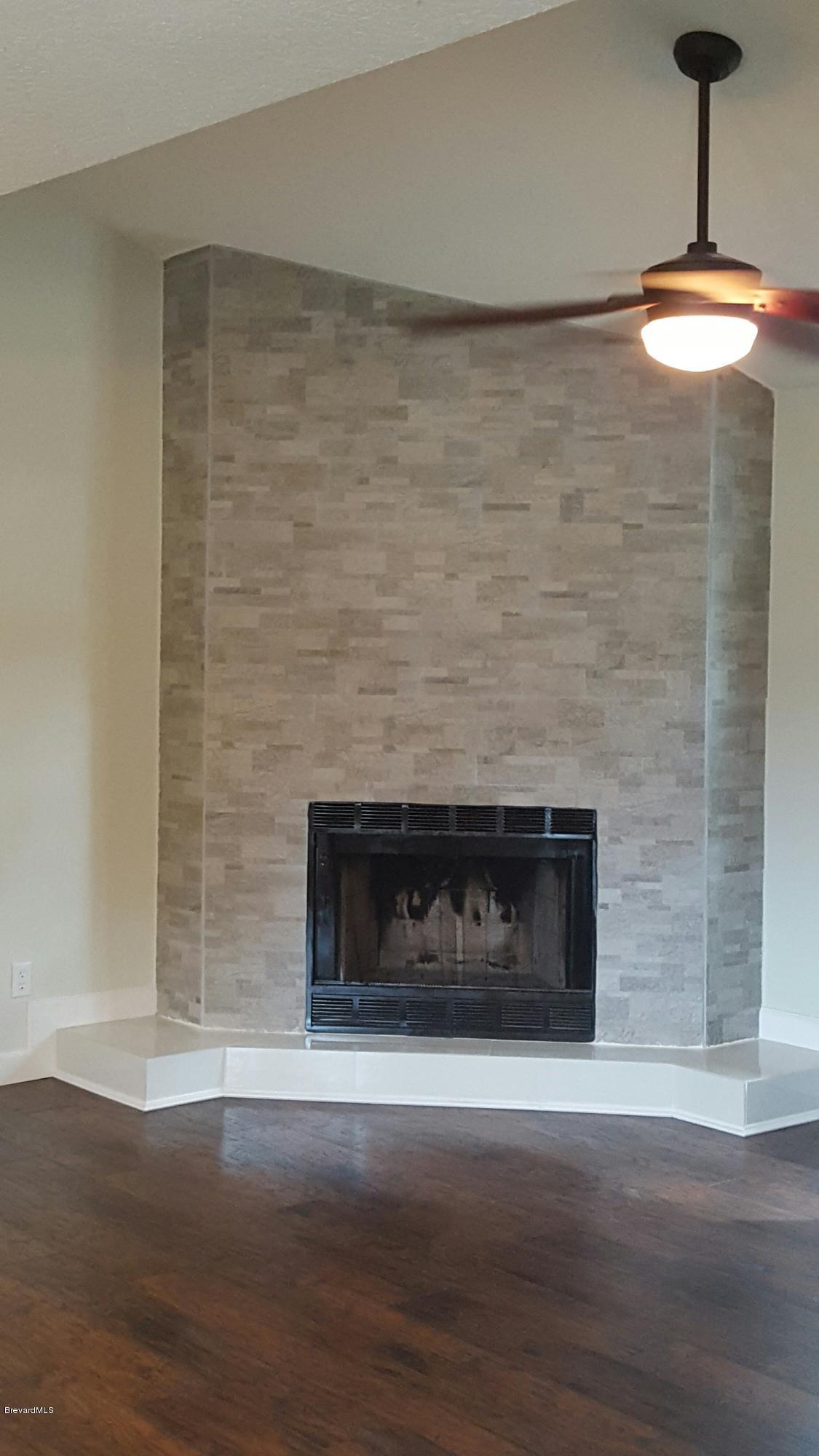 7401 Ester Road Cocoa, FL 32927 - Photo 17 of 41 Close up of stone and tile fireplace