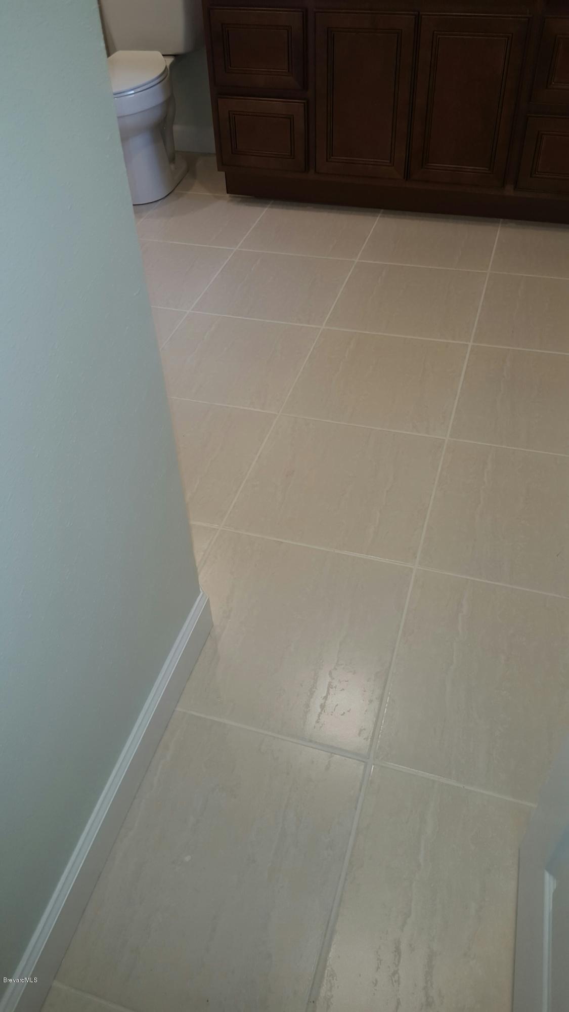7401 Ester Road Cocoa, FL 32927 - Photo 22 of 41 New tile in master bathroom