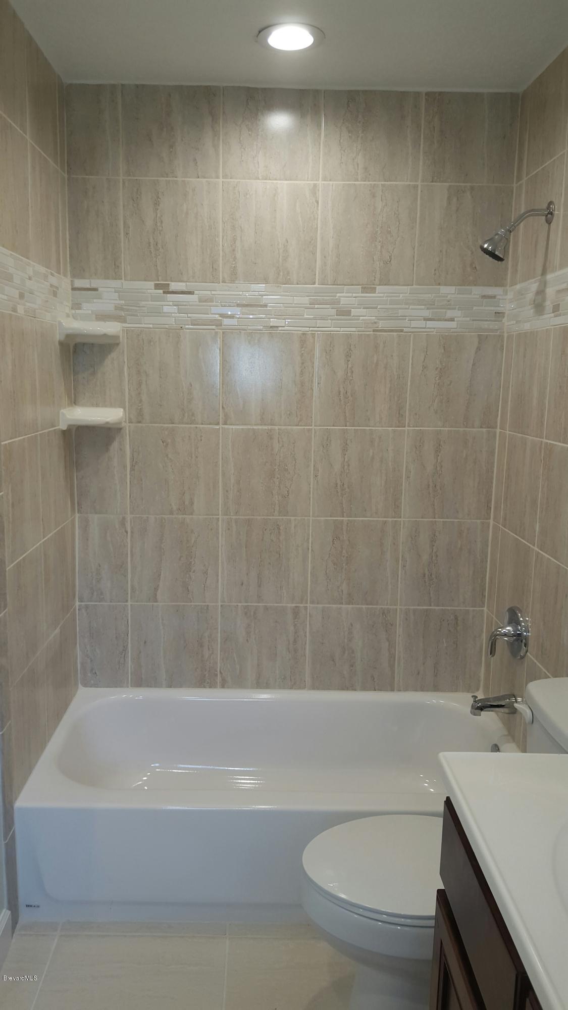 7401 Ester Road Cocoa, FL 32927 - Photo 26 of 41 Brand new tub in master bathroom
