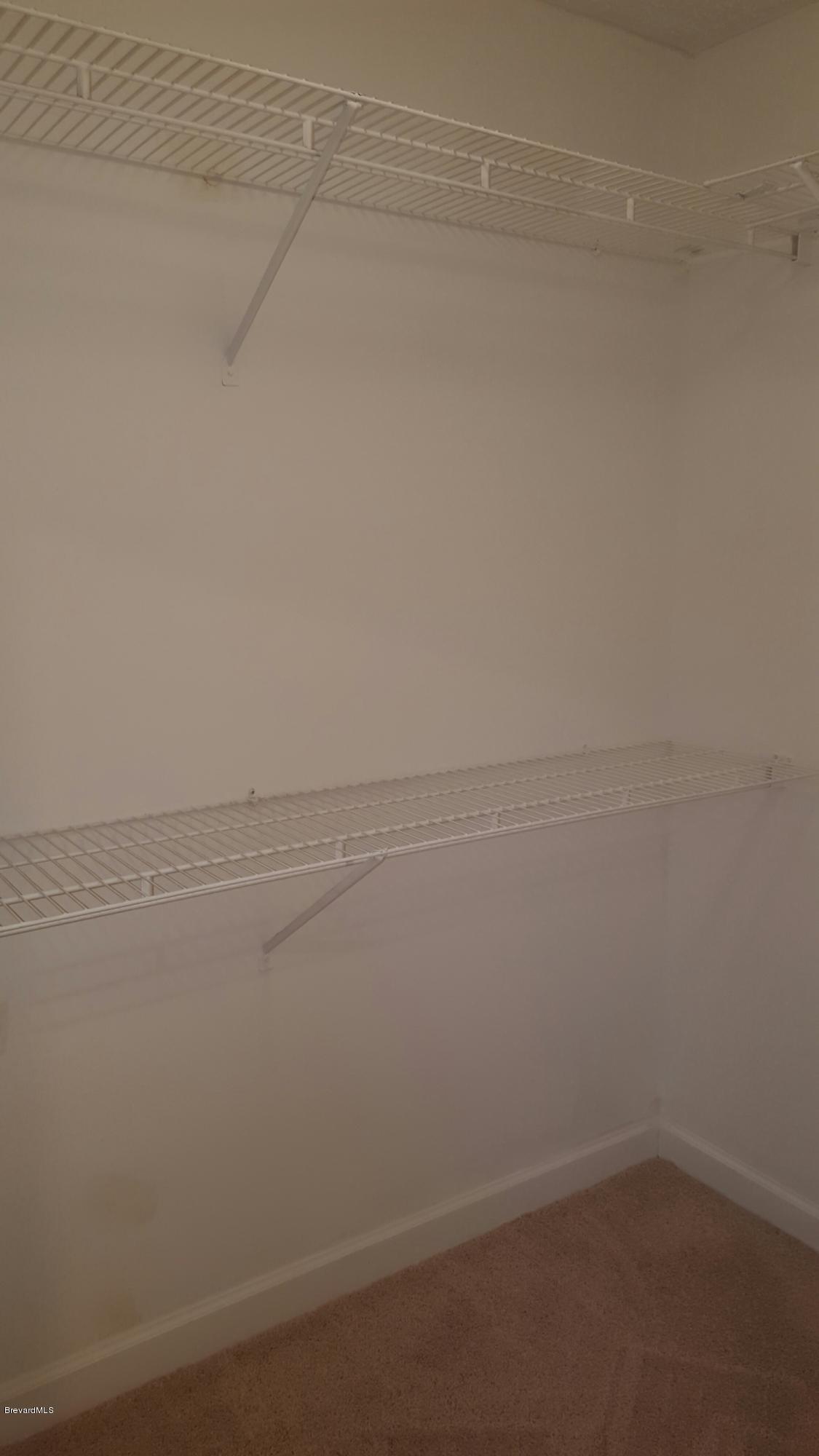 7401 Ester Road Cocoa, FL 32927 - Photo 29 of 41 Walk in closet master bedroom