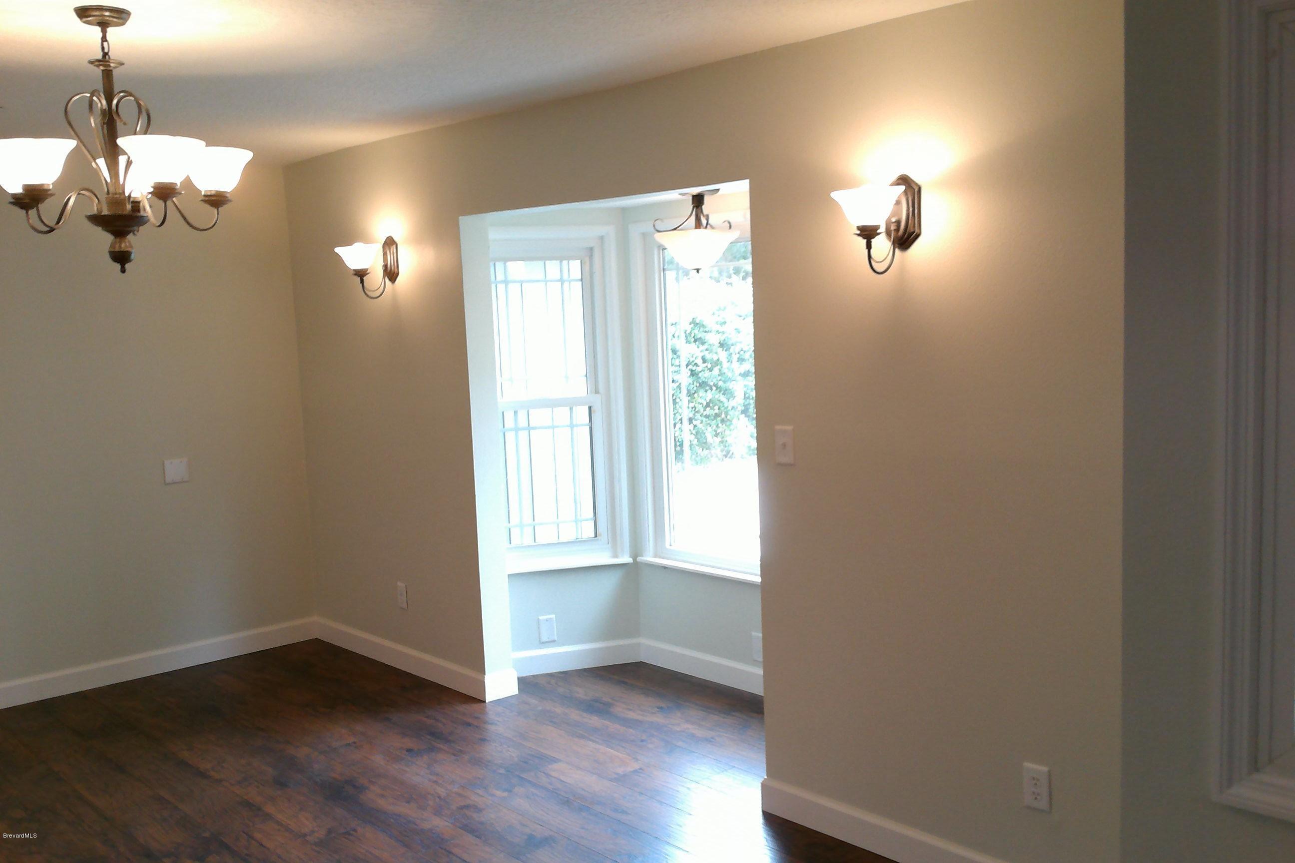 7401 Ester Road Cocoa, FL 32927 - Photo 4 of 41 Living/Dining combo area
