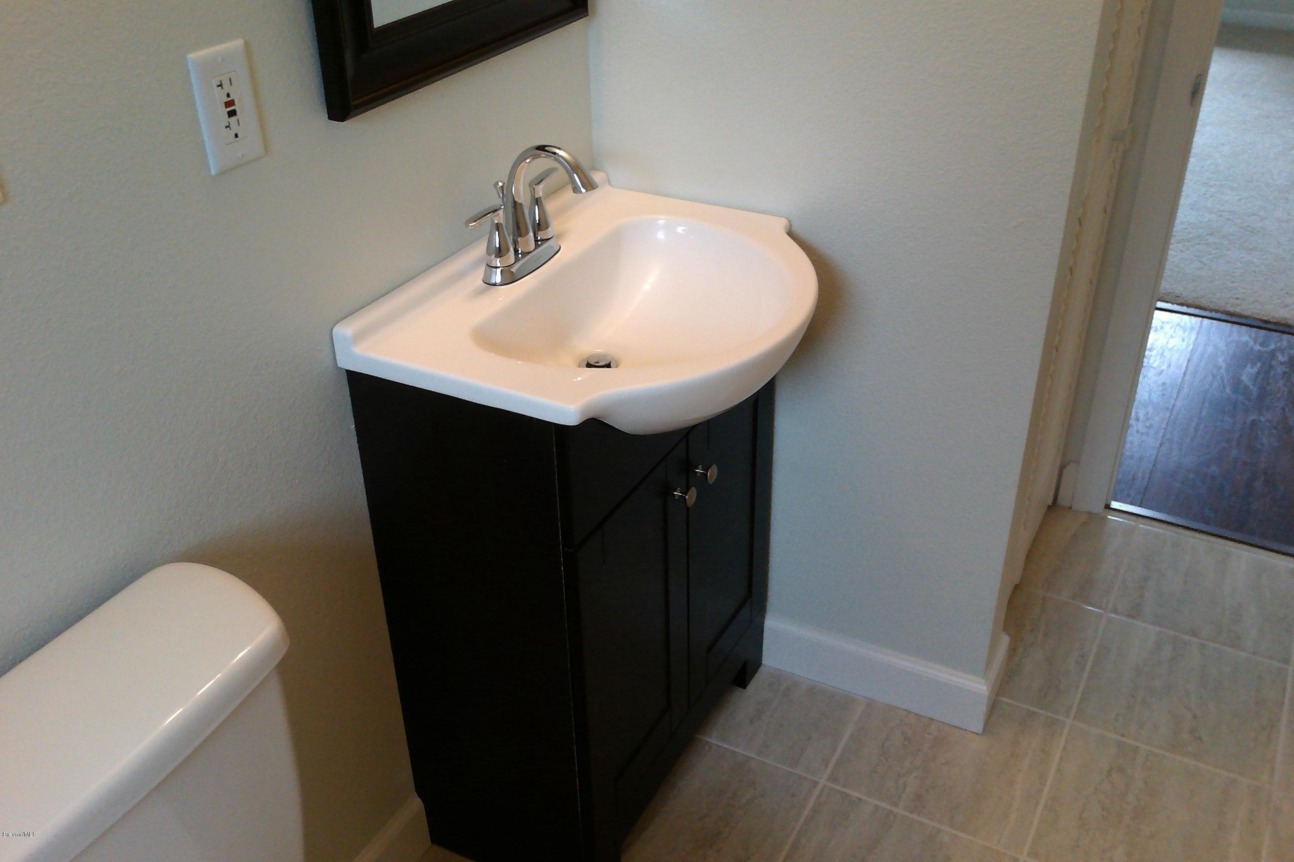 7401 Ester Road Cocoa, FL 32927 - Photo 38 of 41 View of new vanity and linen closet