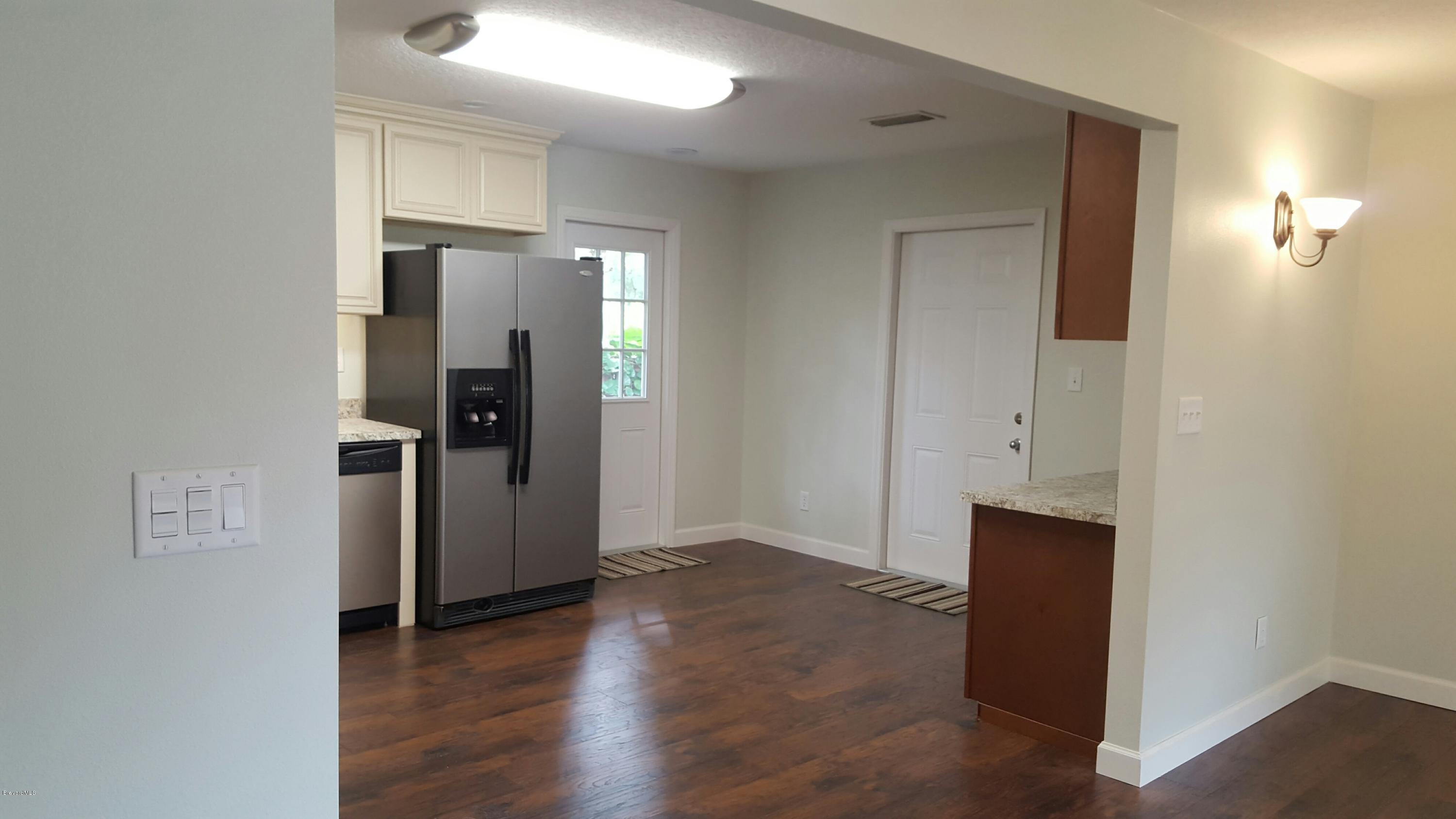 7401 Ester Road Cocoa, FL 32927 - Photo 7 of 41 View of kitchen from dining area