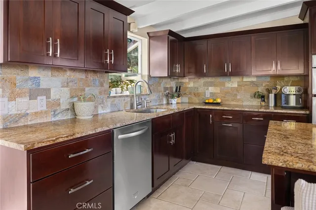 a kitchen with a sink a stove and refrigerator