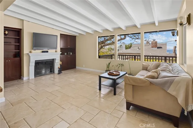 a bedroom with a bed and painting on the wall