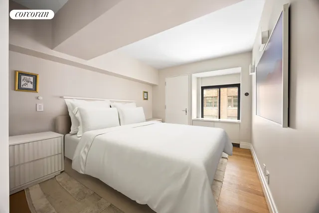 a living room with furniture and stairs