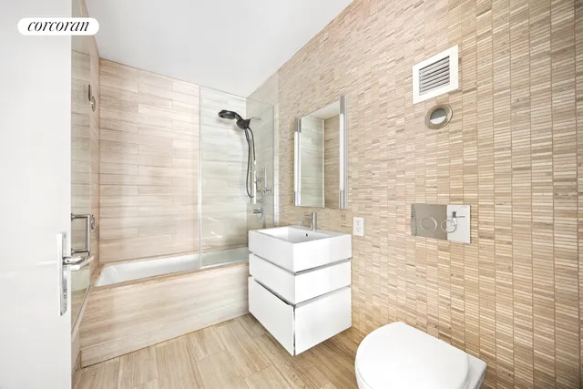 a spacious bedroom with a bed and a window