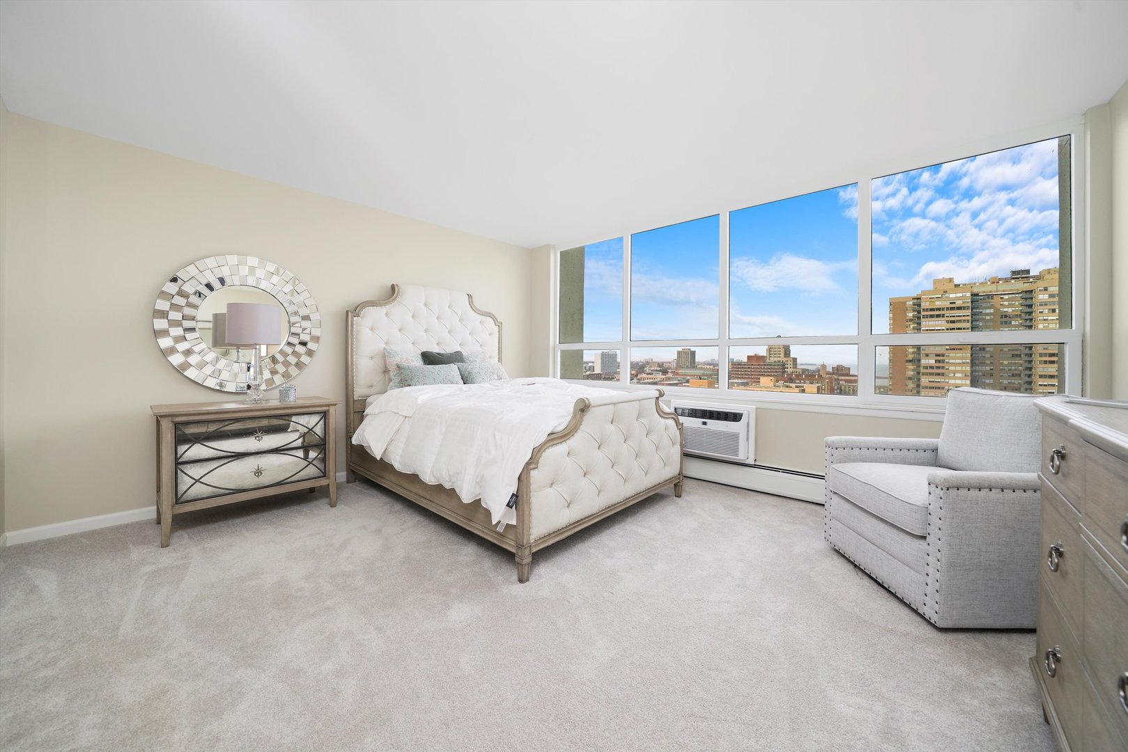 6171 North Sheridan Road, Unit 1401 Chicago, IL 60660 - Photo 13 of 29 a bedroom with a bed couch and window