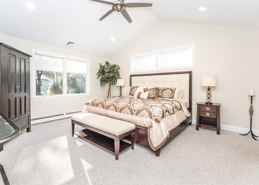 60 Pershing Road Needham, MA 02494 - Photo 13 of 30 a spacious bedroom with a bed and a window