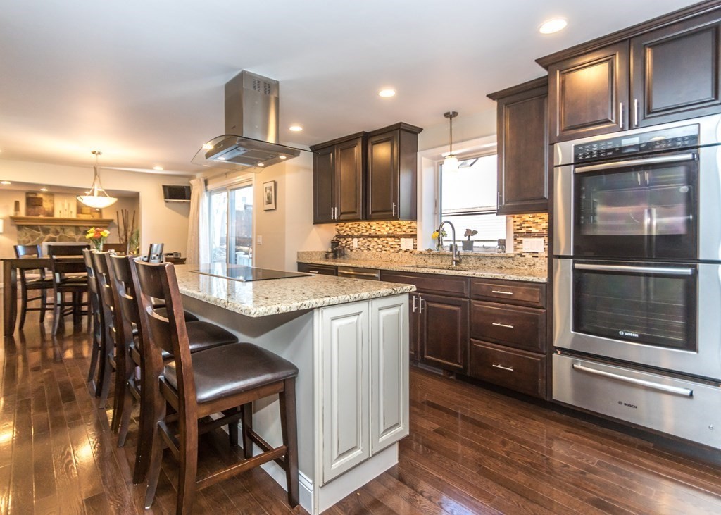60 Pershing Road Needham, MA 02494 - Photo 7 of 30 a kitchen with a stove a sink and a refrigerator