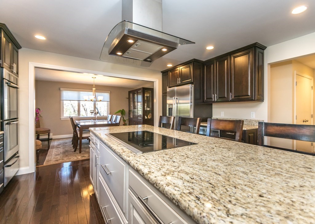 60 Pershing Road Needham, MA 02494 - Photo 8 of 30 a kitchen with a stove sink and cabinets