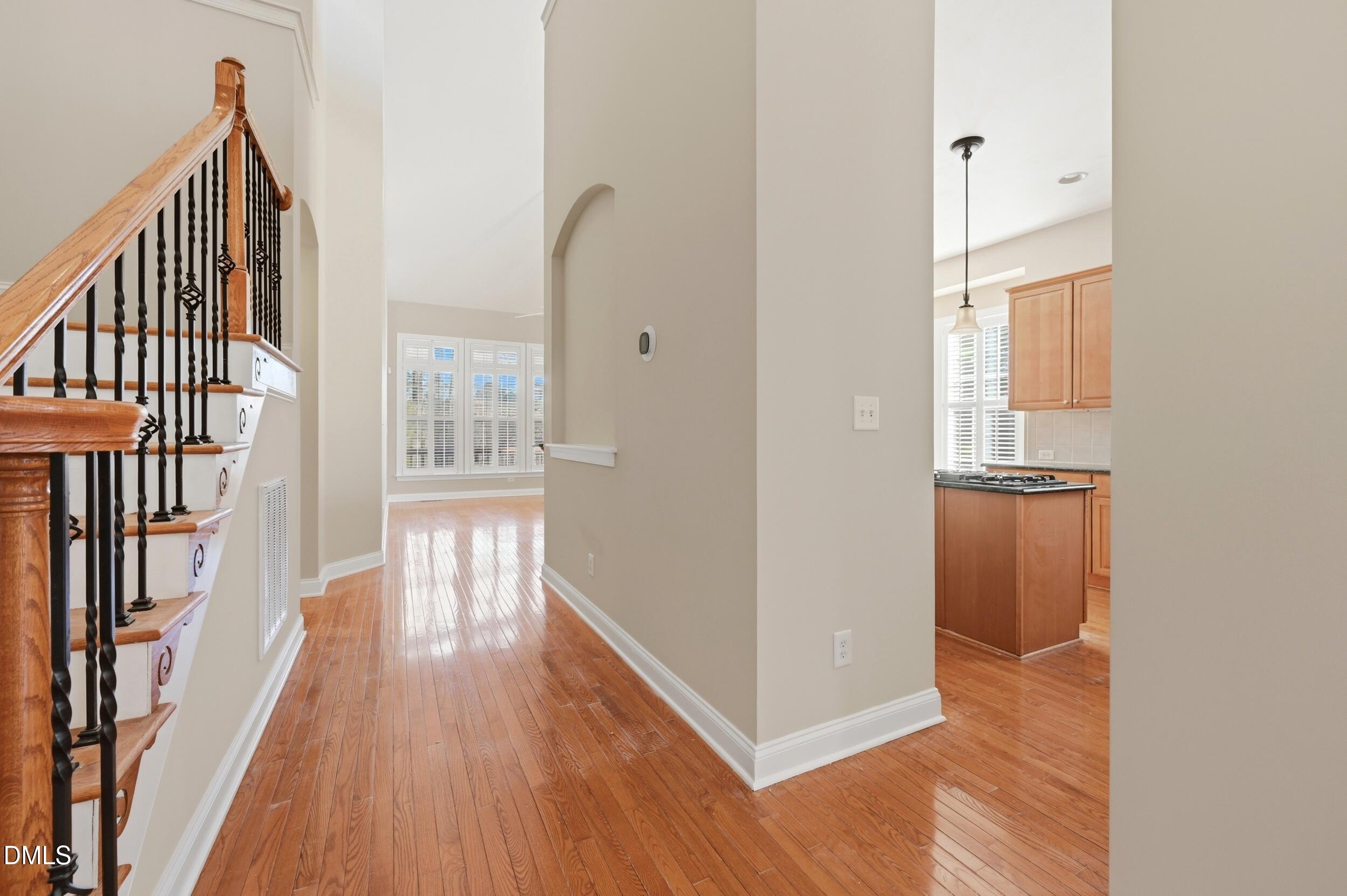 4803 Marena Place Durham, NC 27707 - Photo 7 of 42 a view of hallway with wooden floor