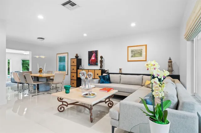 a living room with furniture and a table