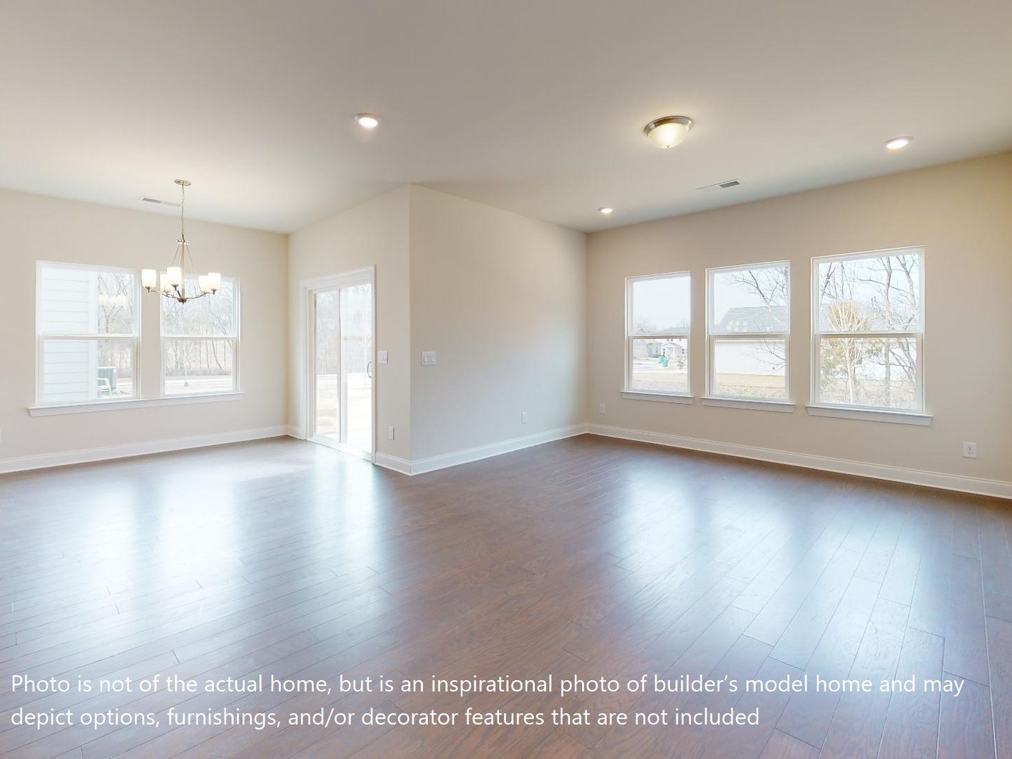 1104 Holland Ridge Way Lebanon, TN 37090 - Photo 11 of 26 an empty room with wooden floor and windows