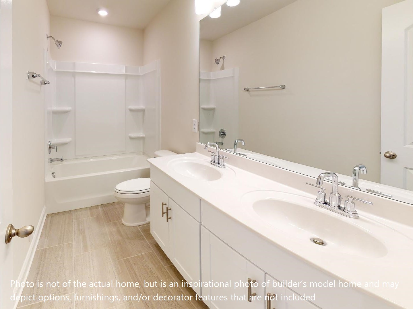 1104 Holland Ridge Way Lebanon, TN 37090 - Photo 20 of 26 a bathroom with a double vanity sink toilet mirror and bathtub