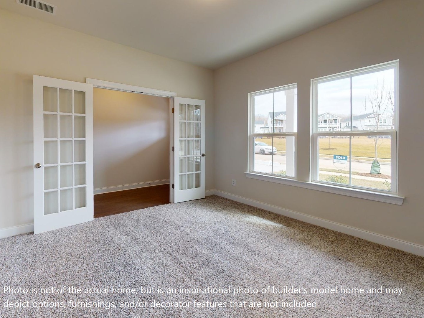 1104 Holland Ridge Way Lebanon, TN 37090 - Photo 22 of 26 an empty room with windows and cabinet