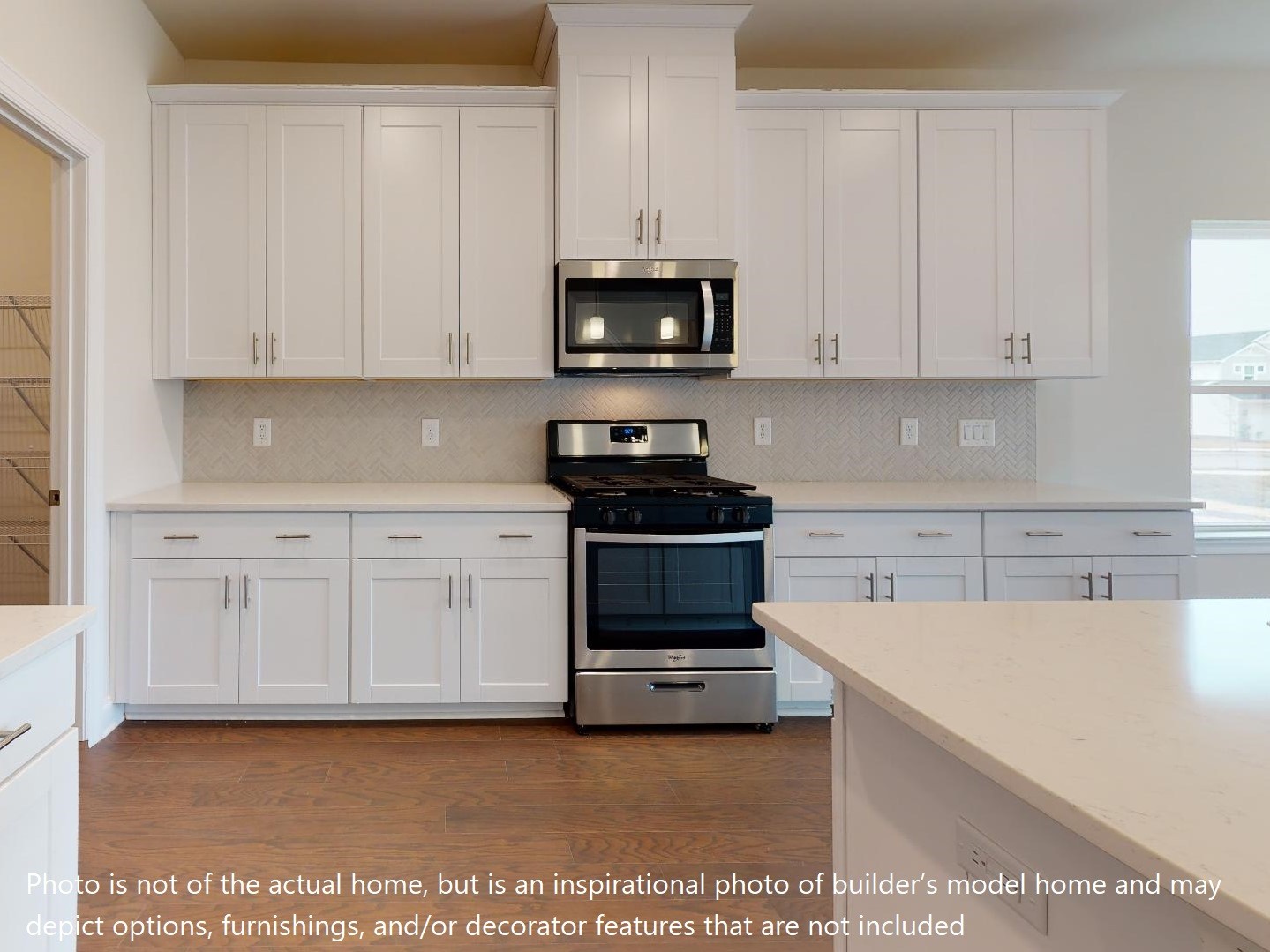 1104 Holland Ridge Way Lebanon, TN 37090 - Photo 24 of 26 a kitchen with granite countertop white cabinets and stainless steel appliances