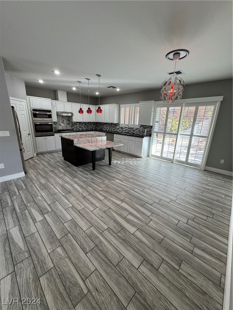 3025 Fort Stanwix Road Henderson, NV 89052 - Photo 44 of 45 Open Floorplan Wood Plank Tile T/O