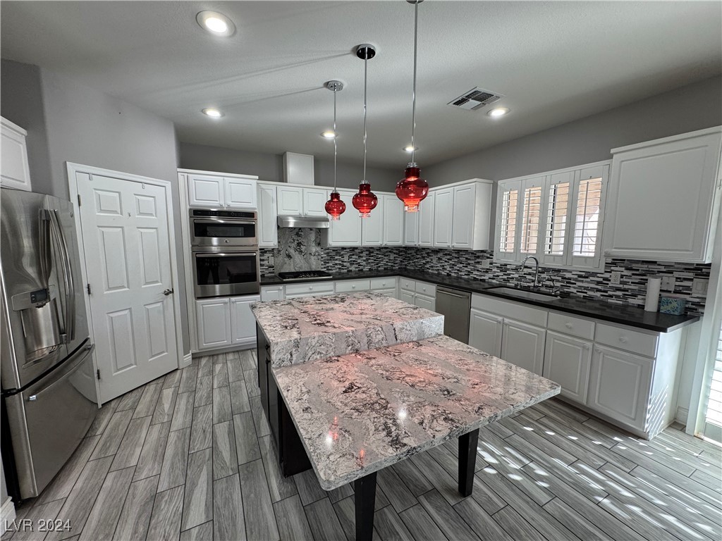 3025 Fort Stanwix Road Henderson, NV 89052 - Photo 8 of 45 Custom Quartz Island with Seating Area