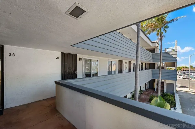 a view of a patio with table and chairs and potted plants