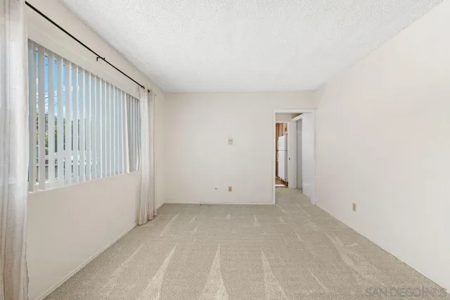 an empty room with closet area