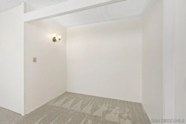 a view of a bathroom from a corridor