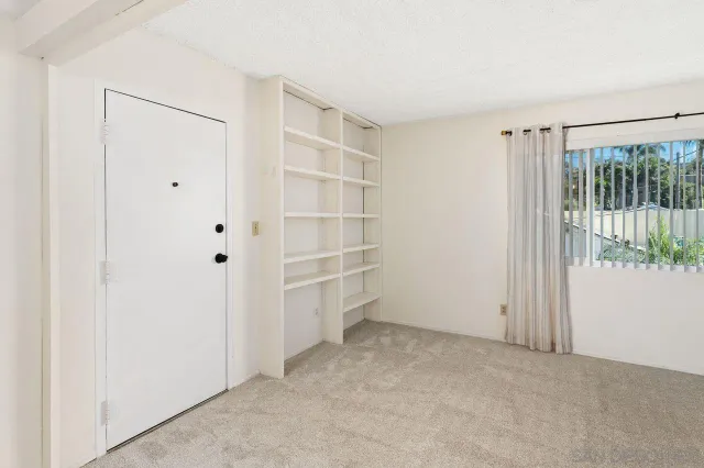 a view of a bathroom from a hallway