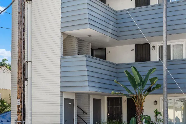 a view of a porch with a potted plant and a ceiling fan