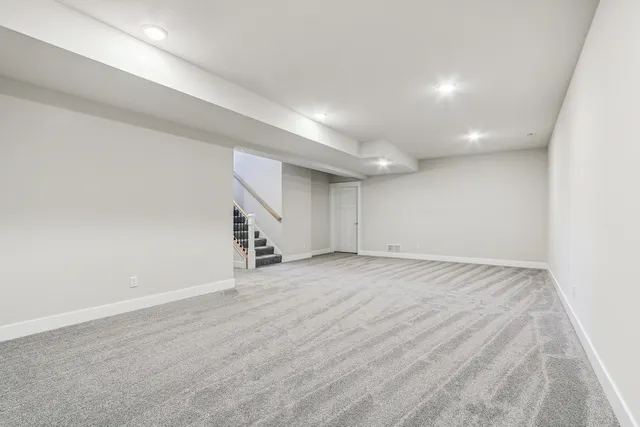 a front view of a house with yard and swimming pool
