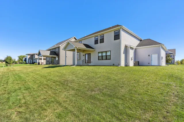 an aerial view of a house with a swimming pool