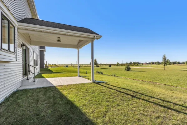 a view of a swimming pool with a yard