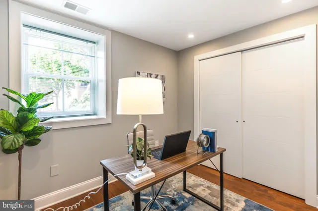 a workspace with furniture and a window