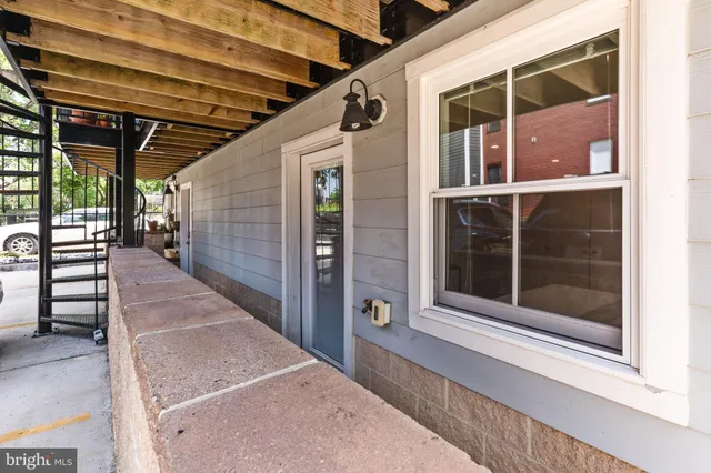 a view of a car garage with a car parked in it