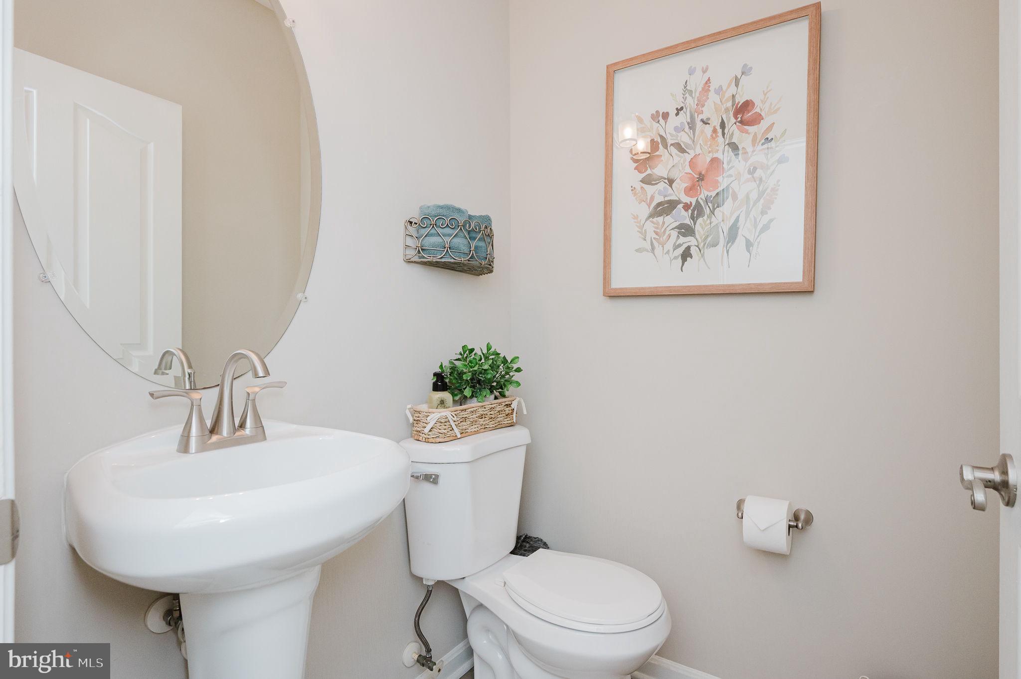 823 Bridle Path Bel Air, MD 21014 - Photo 13 of 66 a bathroom with a toilet a sink and mirror