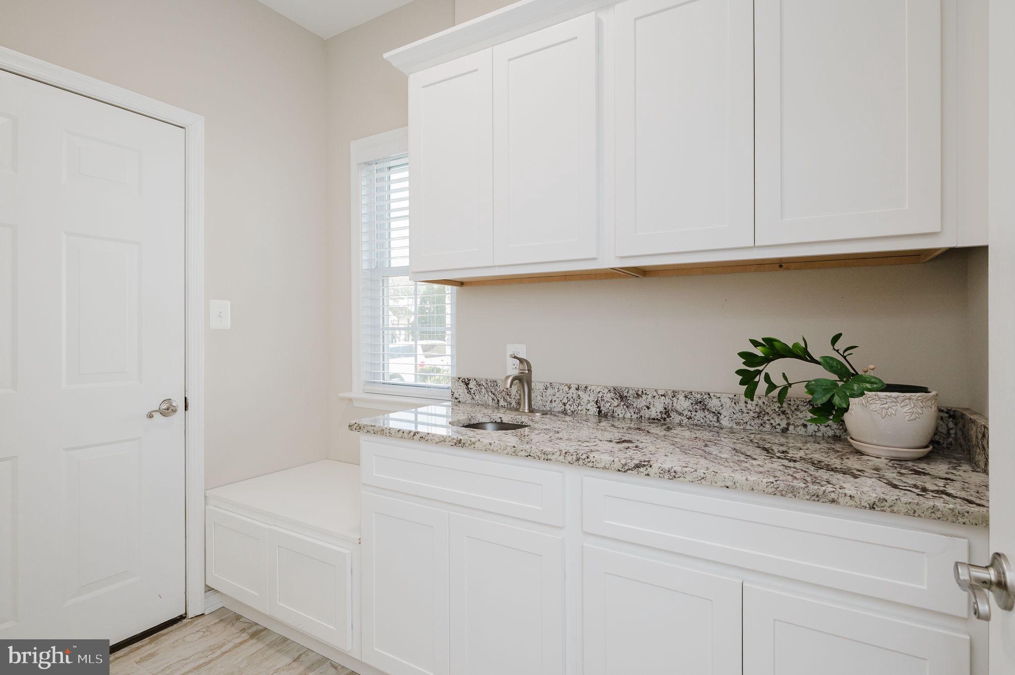 823 Bridle Path Bel Air, MD 21014 - Photo 14 of 66 a bathroom with a sink a potted plant and cabinets