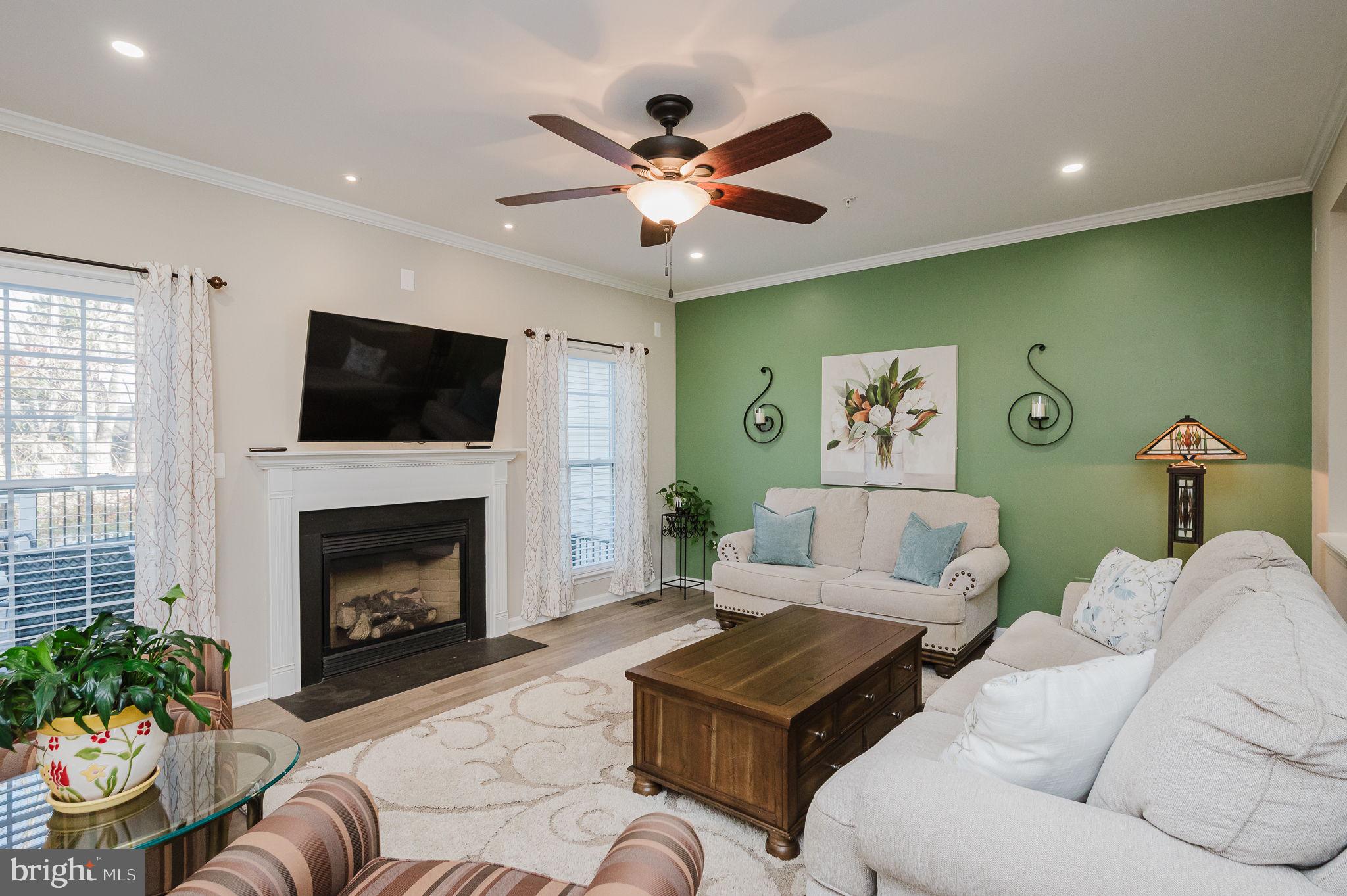 823 Bridle Path Bel Air, MD 21014 - Photo 15 of 66 a living room with furniture a fireplace and a flat screen tv