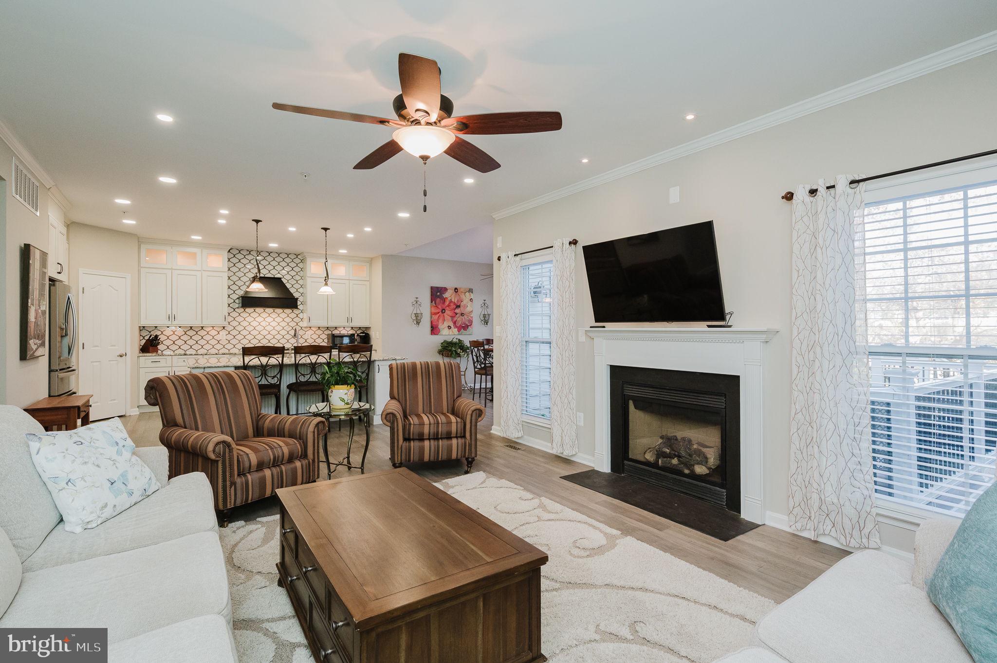 823 Bridle Path Bel Air, MD 21014 - Photo 17 of 66 a living room with furniture a fireplace and a flat screen tv