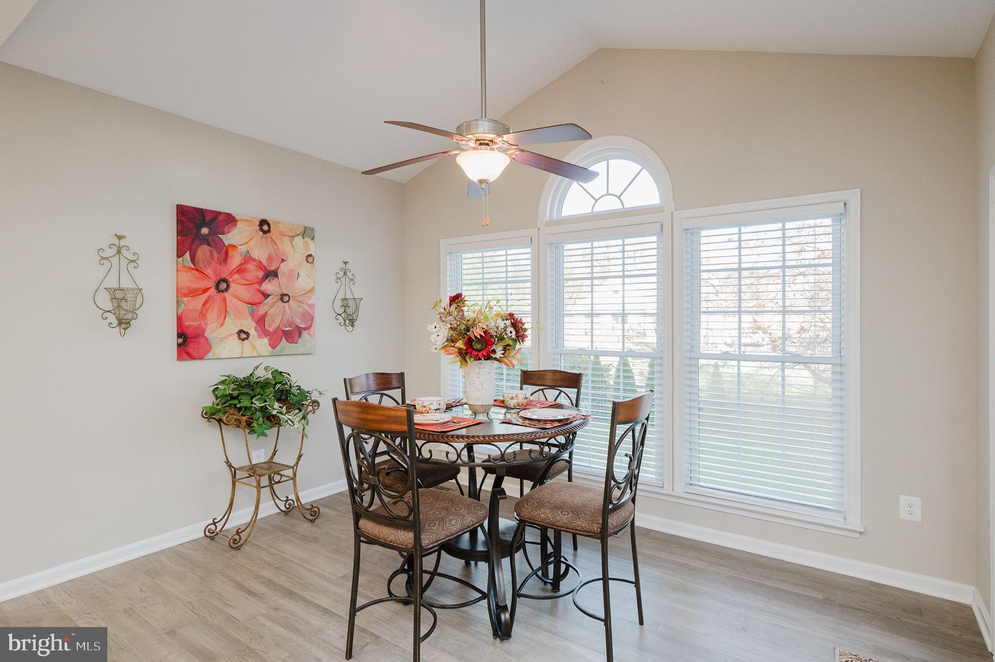 823 Bridle Path Bel Air, MD 21014 - Photo 23 of 66 a dining room with furniture potted plants and wooden floor