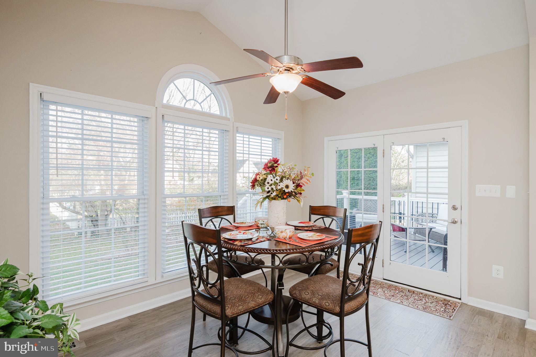 823 Bridle Path Bel Air, MD 21014 - Photo 24 of 66 a dining room with furniture a large window and wooden floor
