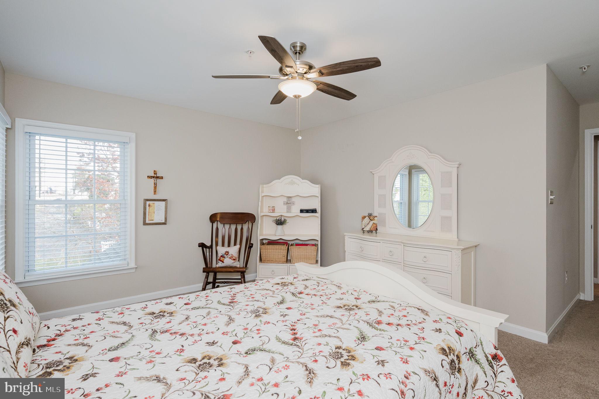823 Bridle Path Bel Air, MD 21014 - Photo 40 of 66 a bedroom with a bed and dresser with mirror