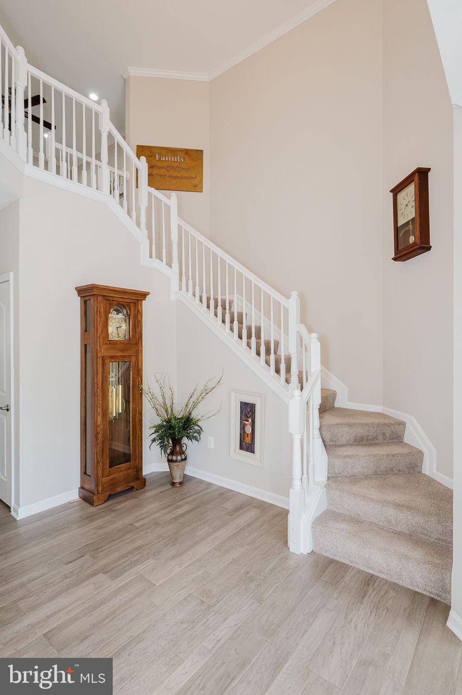 823 Bridle Path Bel Air, MD 21014 - Photo 5 of 66 a view of staircase with wooden floor and a potted plant