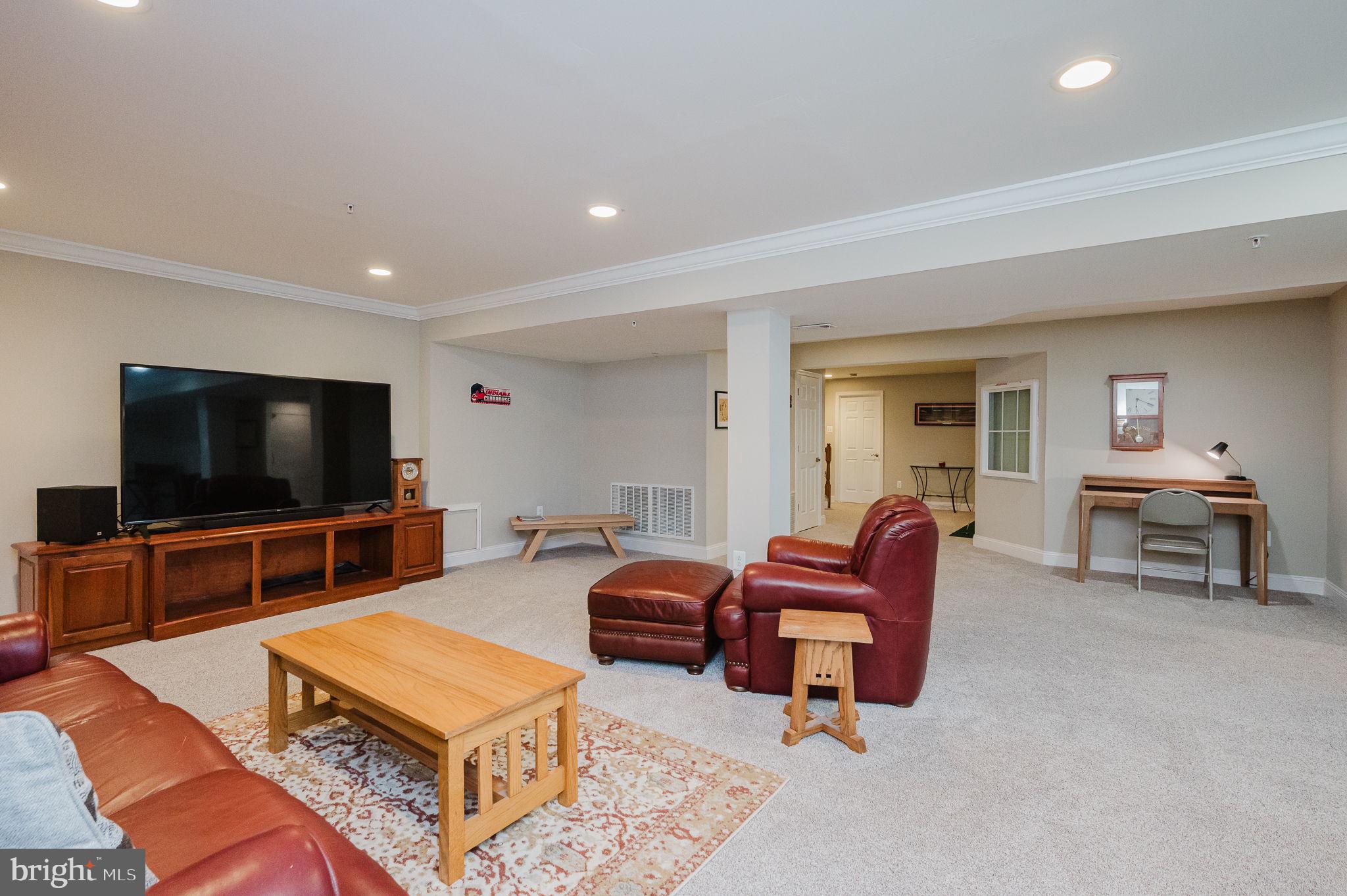 823 Bridle Path Bel Air, MD 21014 - Photo 51 of 66 a living room with furniture and a flat screen tv