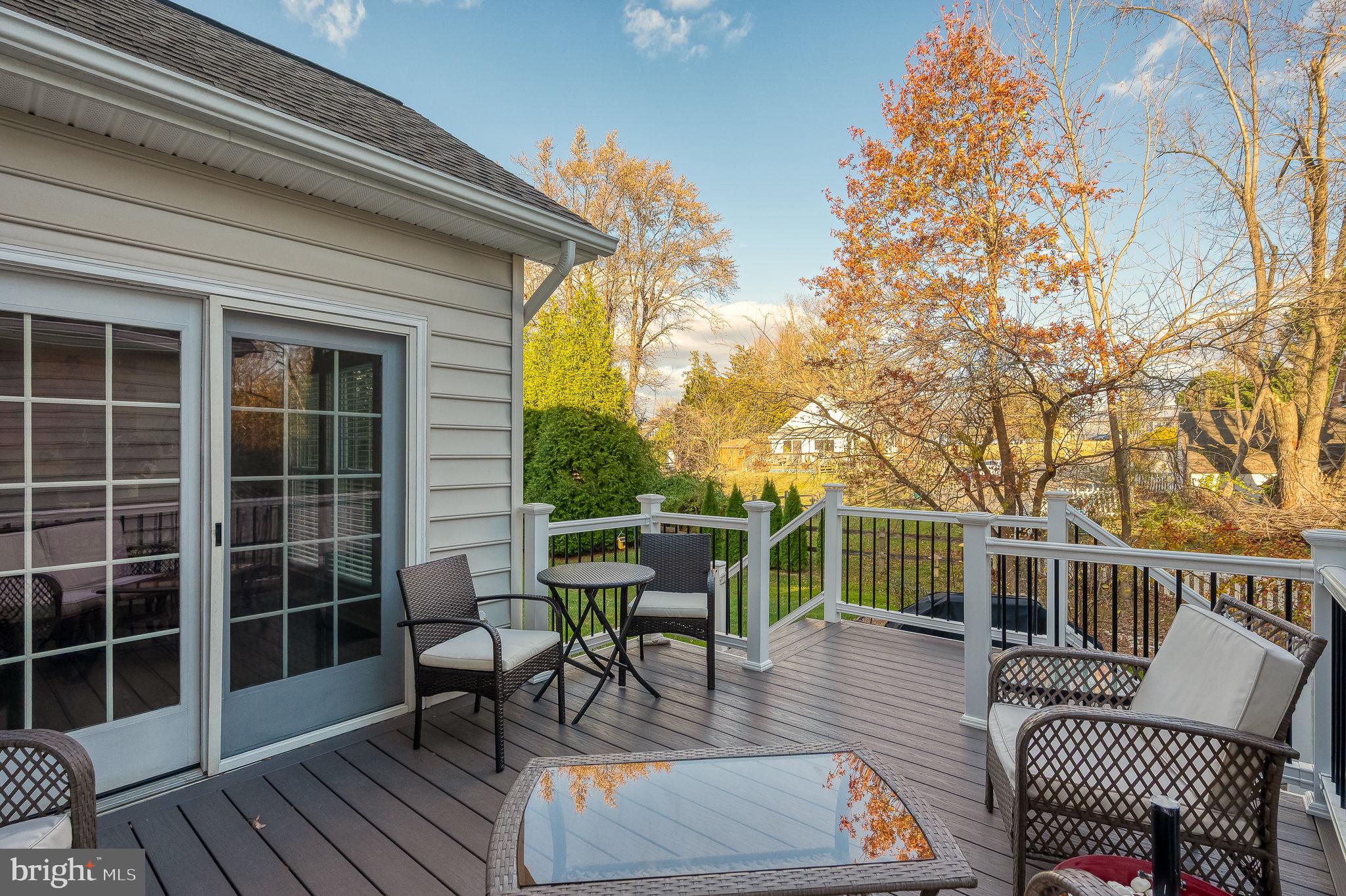 823 Bridle Path Bel Air, MD 21014 - Photo 59 of 66 a view of a deck with couches table and chairs and wooden floor