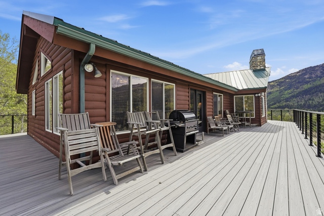 6 Beaver Springs Rancheros Oakley, UT 84055 - Photo 42 of 68 Expansive deck featuring composite decking, cable railing, and mountain scenery