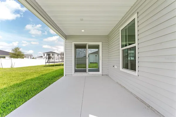a view of a back yard of the house