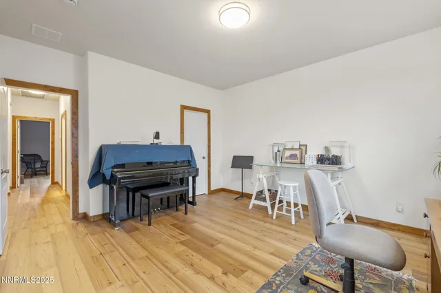 a workspace with furniture and wooden floor