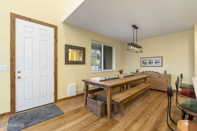 a view of a workspace with furniture and wooden floor